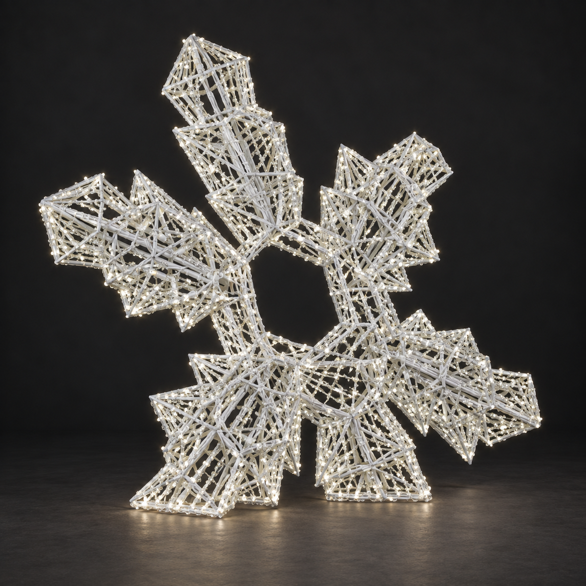 3D Snowflake Sculpture — illuminated sculpture with beaded mini lights, dark studio view