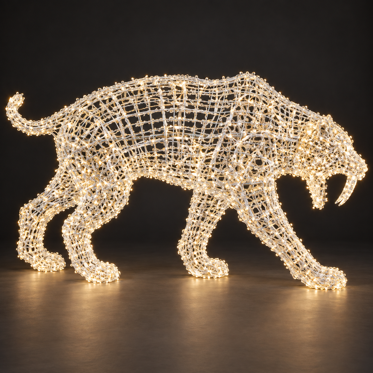 Sabretooth Tiger Sculpture — illuminated sculpture with beaded mini lights, dark studio view