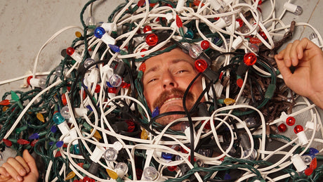 Man tanged up and trapped in Christmas lights