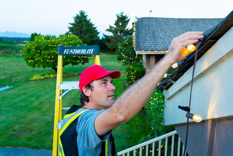 Christmas Light Installer putting up G30 Christmas Lights