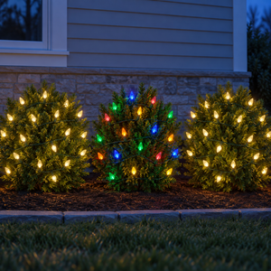 Christmas Foliage Glow Bundle installed-result example showing three c6 foliage zones: two warm white and one multicolor