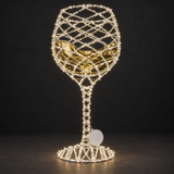 Wine Glass Sculpture — illuminated sculpture with beaded mini lights, dark studio view